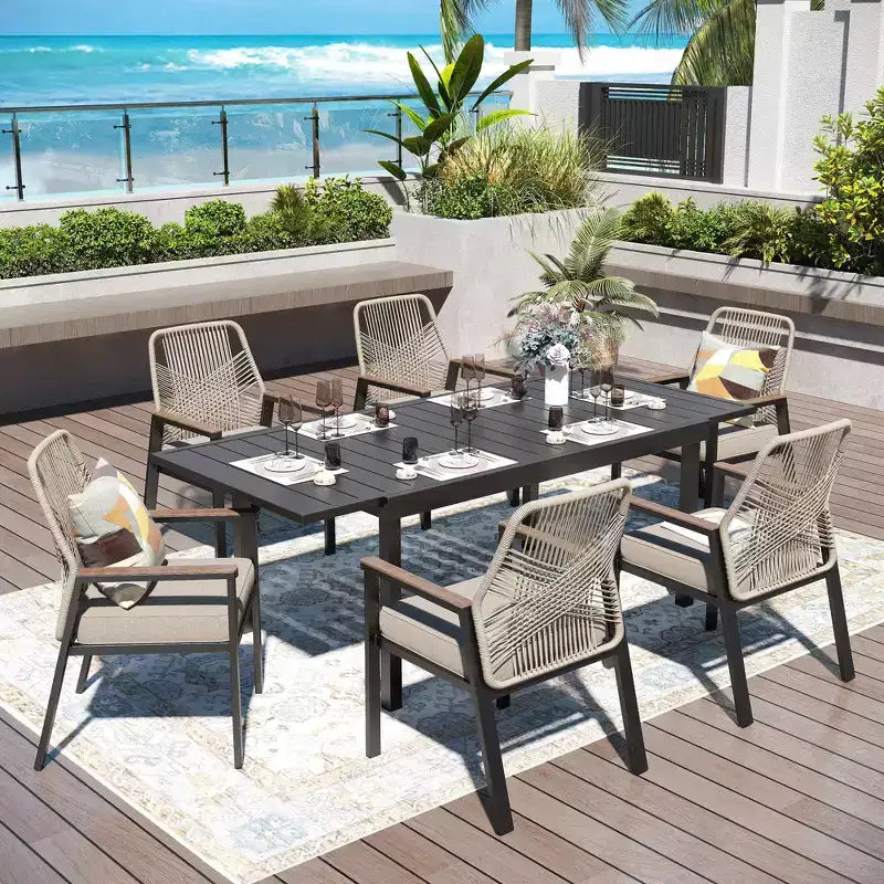 Captiva Designs 7pc Patio Dining Slat-top Steel Table & Beige Rattan Chairs with Cushions