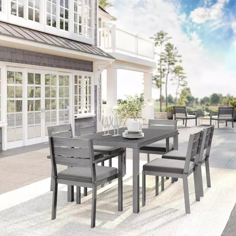 Martha Stewart Bedford Indoor-Outdoor Patio Set with 62 Table and 6 Dining Chairs with Brushed Woodgrain Aluminum Finish and All-Weather Seat Cushion