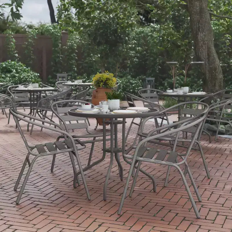 Flash Furniture Lila 31.5'' Round Glass Metal Table with 4 Metal Aluminum Slat Stack Chairs