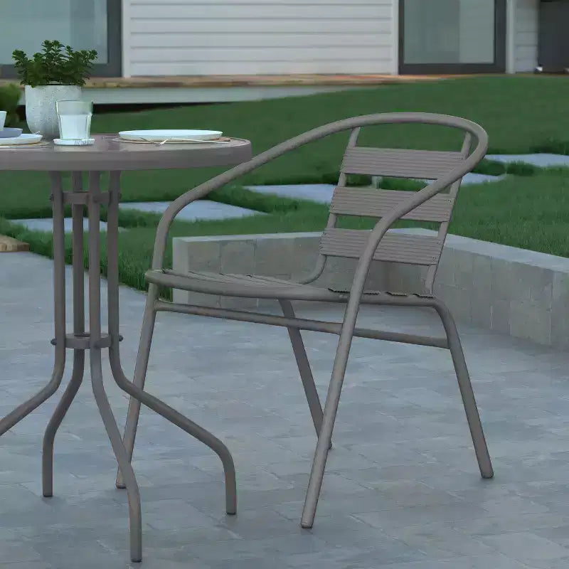 Emma and Oliver 23.75'' Round Glass Top Metal Table with 2 Aluminum Slat Stack Chairs