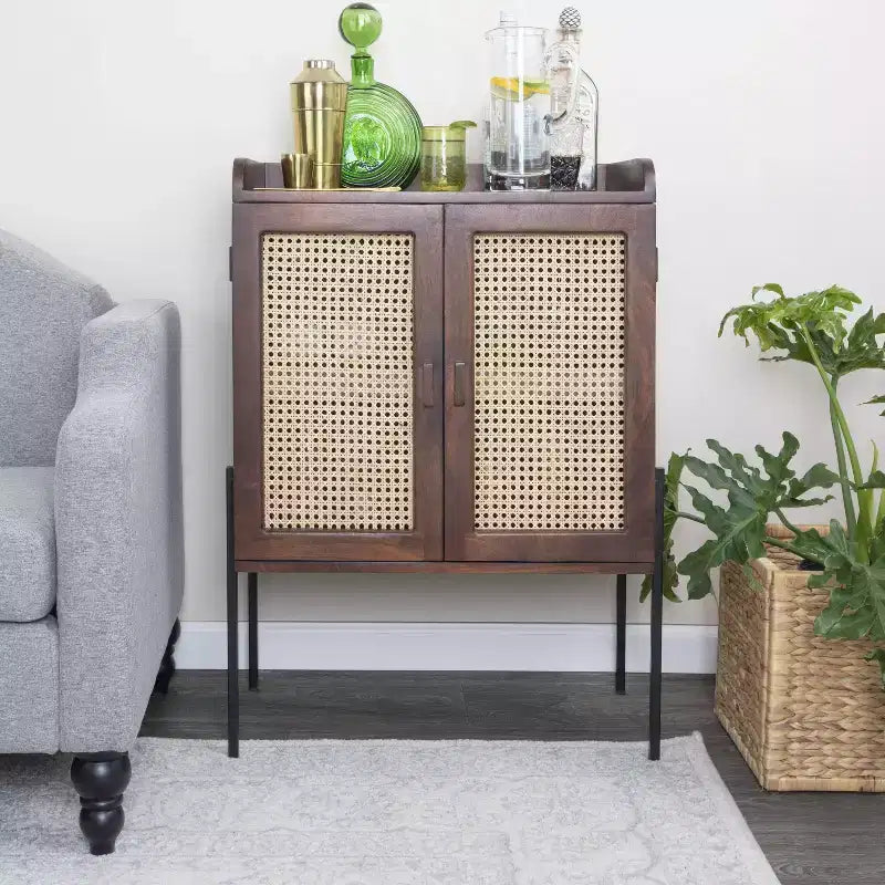 Storied Home Boho Solid Wood Bar Cabinet with Metal Legs and Woven Cane Doors