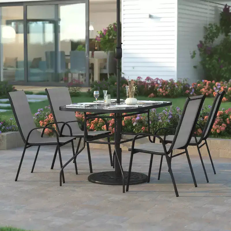 Emma and Oliver 5 Piece Outdoor Dining Set with Tempered Glass Top Patio Table and 4 Flex Comfort Textilene Stacking Chairs